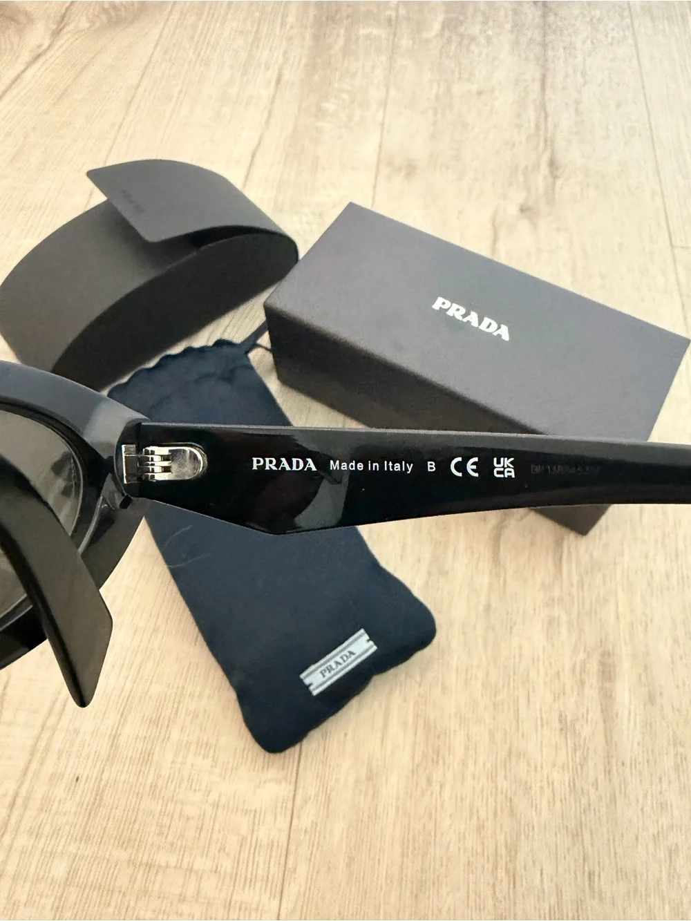 Prada Symbole Black Oval Sunglasses